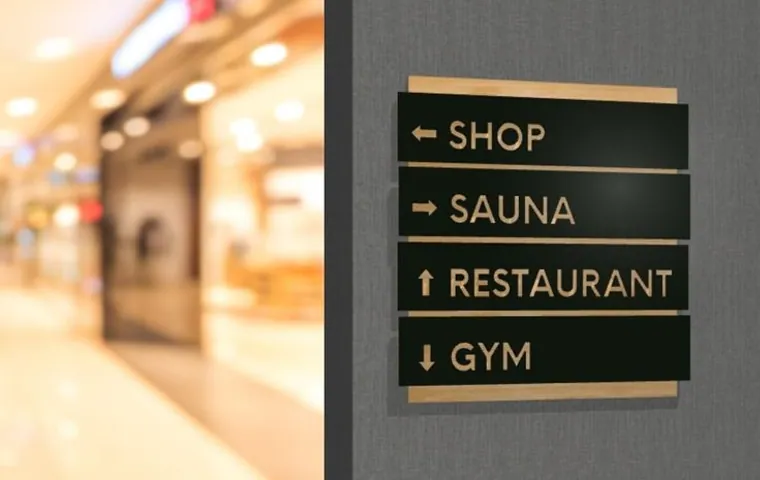 Installed amenity wayfinding sign for shop, sauna, restaurant and gym
