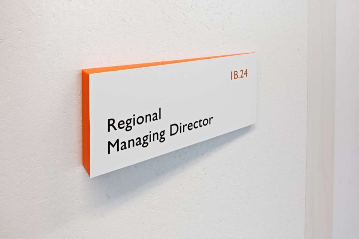 Wall-mounted office identification sign for a regional managing director
